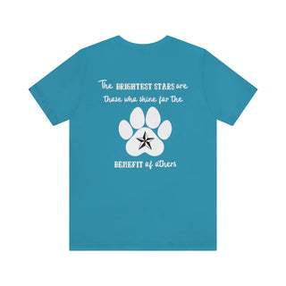 Brightest Star unisex Short Sleeve Tee shirt in blue. The Brightest Star design features a design on the back with the phrase "The brightest stars are those who shine for the benefit of others" with a pawprint and a nautical star.