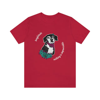 Signature Tattoo Roses Unisex Short Sleeve Tee in Red. Shown is front of shirt with the Signature Tattoo Roses design featuring a dog with roses around it and the phrase "Beagletude" and "Nothing is Impawssible". Back of shirt features the Benefit Beagle Logo.