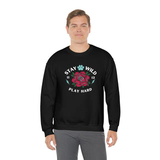 Stay Wild Unisex Heavy Blend Crewneck Sweatshirt in Black. The Stay Wild Design features a tattoo style rose with the phrase "Stay Wild, Play Hard" around it. The back of shirt features the Stay Wild Benefit Beagle Logo Design.