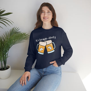 Beagle-Thirty Mugs Unisex Heavy Blend Crewneck Sweatshirt in Navy. The front of shirt showcases Two Dog Adorned Mugs clinking with the saying, "It's Beagle-Thirty" above it. Back of shirt features corresponding Benefit Beagle Logo.