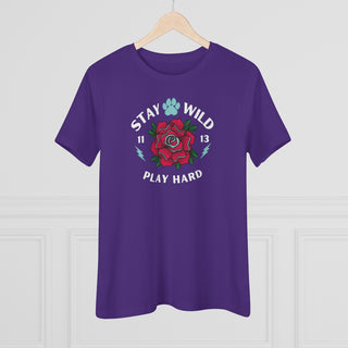 Stay Wild Women's Premium Tee in Team Purple. Shown is front of Stay Wild Design features a tattoo style rose with the phrase "Stay Wild, Play Hard" around it. The back of shirt features the Stay Wild Benefit Beagle Logo Design.