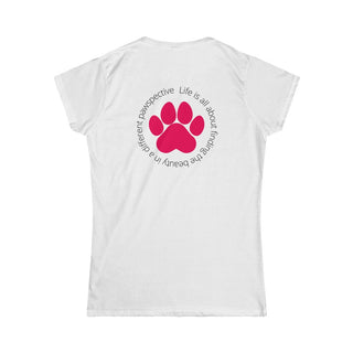 Different Pawspective Women's Softstyle Tee in White. Shown is the back of shirt featuring a large colorful pawprint with the the phrase "Life is all about finding the beauty in a different pawspective" circled around it. The Benefit Beagle Logo is located in the top corner on the front of shirt.