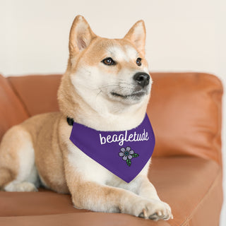 Dog wearing the Signature Tattoo Flower Dog Collar Bandana in Purple. The Signature Tattoo Flower design features the word "beagletude" with a tattoo style flower under it. Comes with adjustable black collar.