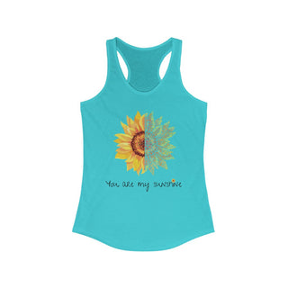 You are my Sunshine Women's Racerback Tank in Tahiti Blue. Shown is the front showcasing a sunflower which is split down the middle and half is made out of paw prints. Underneath is the phrase "You are my Sunshine" . Back of shirt features the Sunflower Benefit Beagle Logo.