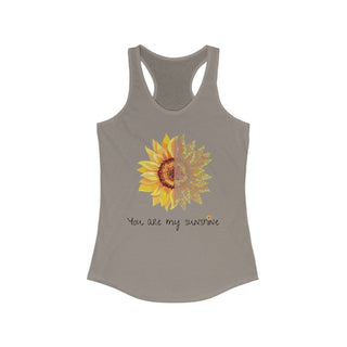 You are my Sunshine Women's Racerback Tank in Warm Grey. Shown is the front showcasing a sunflower which is split down the middle and half is made out of paw prints. Underneath is the phrase "You are my Sunshine" . Back of shirt features the Sunflower Benefit Beagle Logo.