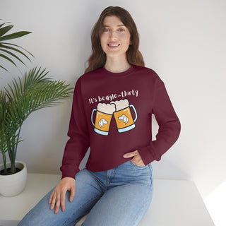 Beagle-Thirty Mugs Unisex Heavy Blend Crewneck Sweatshirt in Maroon. The front of shirt showcases Two Dog Adorned Mugs clinking with the saying, "It's Beagle-Thirty" above it. Back of shirt features corresponding Benefit Beagle Logo.