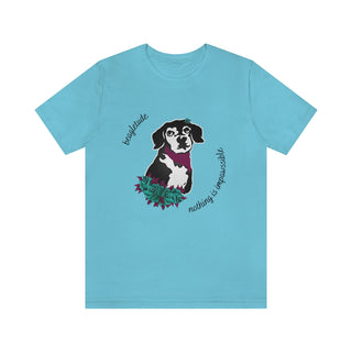 Signature Tattoo Roses Unisex Short Sleeve Tee in Turquoise. Shown is front of shirt with the Signature Tattoo Roses design featuring a dog with roses around it and the phrase "Beagletude" and "Nothing is Impawssible". Back of shirt features the Benefit Beagle Logo.