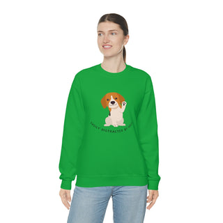 Easily Distracted Unisex Heavy Blend Crewneck Sweatshirt in Kelly Green. Shown is front design featuring a dog waving with the saying "Easily Distracted by Dogs" below it. The back of shirt has the classic Benefit Beagle Logo.