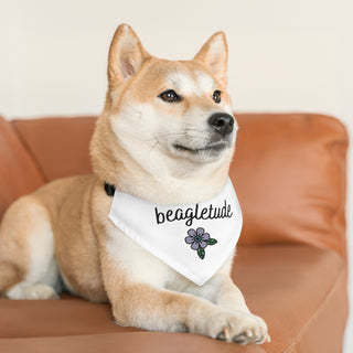 Dog wearing the Signature Tattoo Flower Dog Collar Bandana in White. The Signature Tattoo Flower design features the word "beagletude" with a tattoo style flower under it. Comes with adjustable black collar.