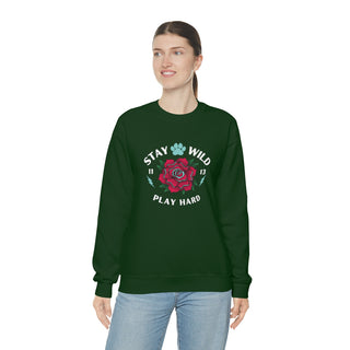 Stay Wild Unisex Heavy Blend Crewneck Sweatshirt in Forest Green. The Stay Wild Design features a tattoo style rose with the phrase "Stay Wild, Play Hard" around it. The back of shirt features the Stay Wild Benefit Beagle Logo Design.