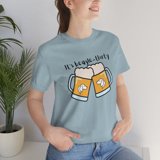 Beagle-Thirty Mugs Unisex Jersey Short Sleeve Tee in Light Blue. The front of shirt showcases Two Dog Adorned Mugs clinking with the saying, "It's Beagle-Thirty" above it. Back of shirt features corresponding Benefit Beagle Logo.