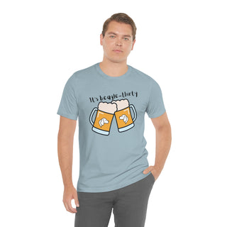 Beagle-Thirty Mugs Unisex Jersey Short Sleeve Tee in Light Blue. The front of shirt showcases Two Dog Adorned Mugs clinking with the saying, "It's Beagle-Thirty" above it. Back of shirt features corresponding Benefit Beagle Logo.