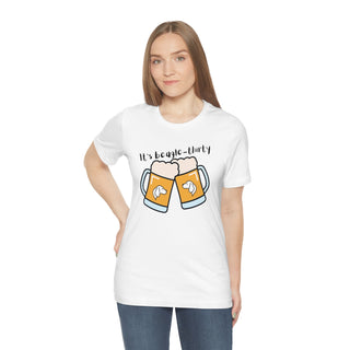 Beagle-Thirty Mugs Unisex Jersey Short Sleeve Tee in White. The front of shirt showcases Two Dog Adorned Mugs clinking with the saying, "It's Beagle-Thirty" above it. Back of shirt features corresponding Benefit Beagle Logo.