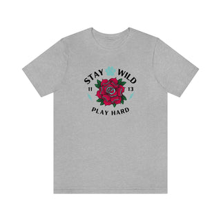 Stay Wild Unisex Premium Tee in Athletic Heather. Shown is front of Stay Wild Design features a tattoo style rose with the phrase "Stay Wild, Play Hard" around it. The back of shirt features the Stay Wild Benefit Beagle Logo Design.