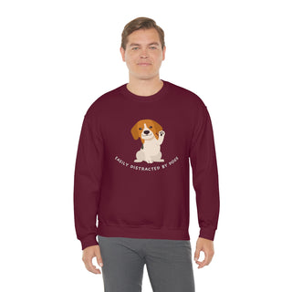 Easily Distracted Unisex Heavy Blend Crewneck Sweatshirt in Maroon. Shown is front design featuring a dog waving with the saying "Easily Distracted by Dogs" below it. The back of shirt has the classic Benefit Beagle Logo.