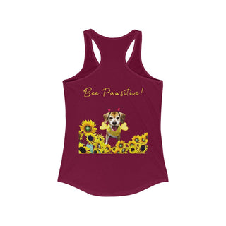 Bee Pawsitive Women's Racerback Tank in Cardinal Red. Shown is back of shirt showcasing a dog dressed as as bee in a a field of sunflowers with the phrase "Bee Pawsitive!" above it. The front features the Bee Pawsitive Benefit Beagle Logo.