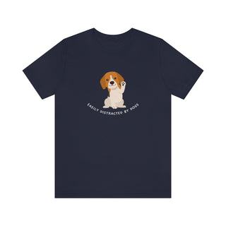 Easily Distracted Unisex Jersey Short Sleeve Tee in Navy. Shown is front design featuring a dog waving with the saying "Easily Distracted by Dogs" below it. The back of shirt has the classic Benefit Beagle Logo.