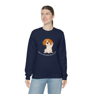 Easily Distracted Unisex Heavy Blend Crewneck Sweatshirt in Navy. Shown is front design featuring a dog waving with the saying "Easily Distracted by Dogs" below it. The back of shirt has the classic Benefit Beagle Logo.