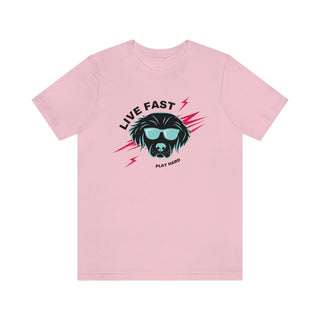 Play Hard Unisex Jersey Short Sleeve Tee Shirt in Pink. The design features a cool dog with sunglasses and lightening bolts arond it. The phrase "Live Fast, Play Hard" is around the design.