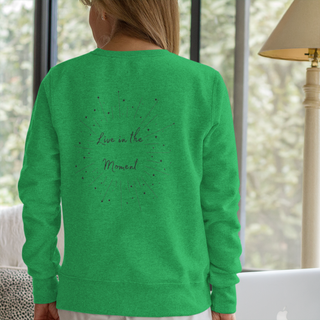 Live in the Moment Crewneck Sweatshirt in Irish Green. The Live in the Moment design features a graphic on the back with the phrase "Live in the Moment" surrounded by shooting stars.