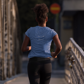 Live in the Moment V-Neck Tee in True Royal. The Live in the Moment design features a graphic on the back with the phrase "Live in the Moment" surrounded by shooting stars.