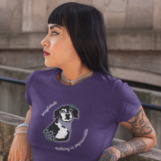 Signature Tattoo Flowers Women's Premium Tee in Purple. Shown is front of shirt with the Signature Tattoo Flowers design featuring a dog with flowers around it and the phrase "Beagletude" and "Nothing is Impawssible". Back of shirt features the Benefit Beagle Logo. 