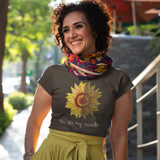 You are my Sunshine Women's Softstyle Tee in Dark Chocolate. Shown is the front showcasing a sunflower which is split down the middle and half is made out of paw prints. Underneath is the phrase "You are my Sunshine" . Back of shirt features the Sunflower Benefit Beagle Logo.